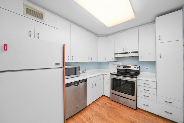 kitchen featuring light hardwood / wood-style floors, sink, stainless steel appliances, and white cabinetry