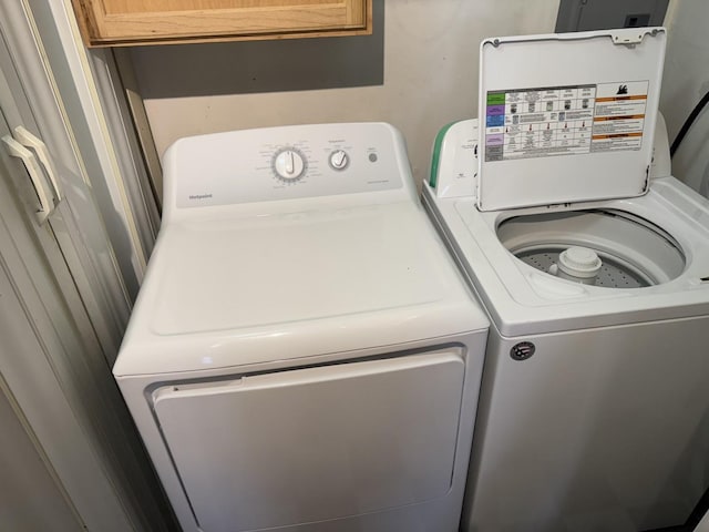 laundry room featuring washing machine and clothes dryer