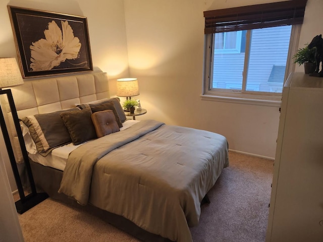 bedroom with light colored carpet