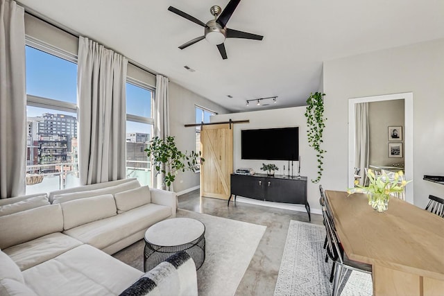 949 W Madison St Unit 601B, Chicago, IL 60607 - living area featuring a barn door, baseboards, a ceiling fan, and finished concrete floors