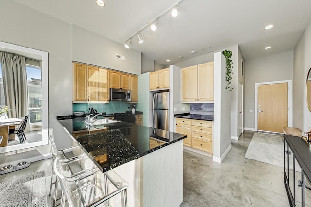 949 W Madison St Unit 601B, Chicago, IL 60607 - kitchen with appliances with stainless steel finishes, concrete floors, a sink, light brown cabinets, and decorative backsplash