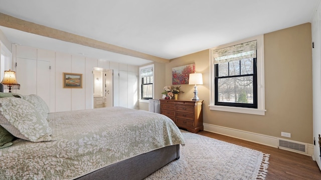 bedroom featuring dark hardwood / wood-style floors