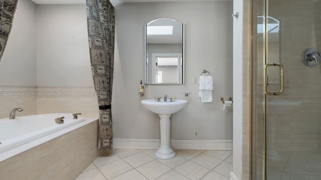 bathroom with separate shower and tub and tile patterned flooring