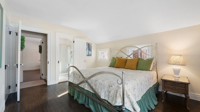 bedroom with dark hardwood / wood-style flooring and vaulted ceiling