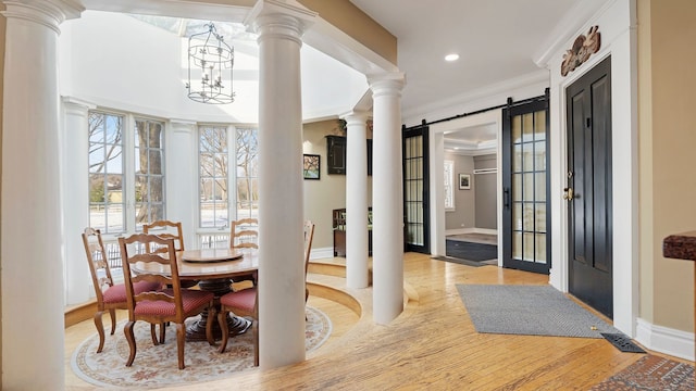 dining space featuring ornamental molding and a chandelier