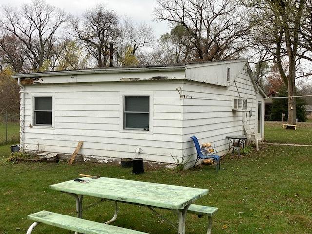 back of house with a yard