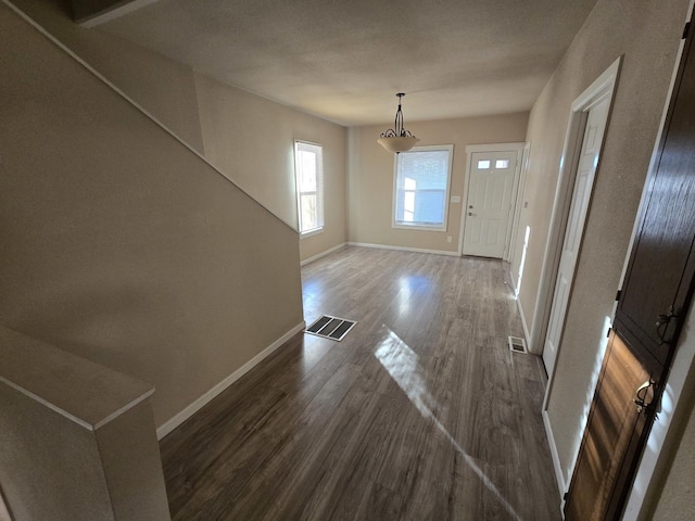 foyer with dark hardwood / wood-style floors