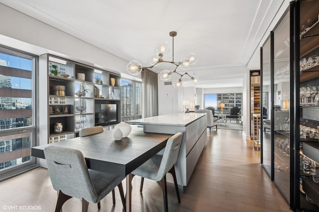 dining room with light wood-type flooring and an inviting chandelier