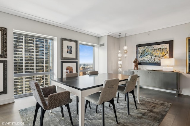 dining space with dark hardwood / wood-style floors