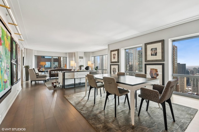 dining area with dark hardwood / wood-style flooring