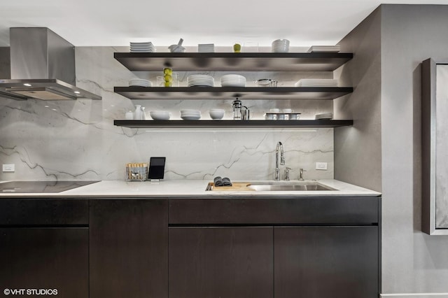 bar with decorative backsplash, sink, black electric stovetop, and extractor fan