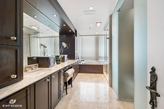 bathroom with vanity and plus walk in shower