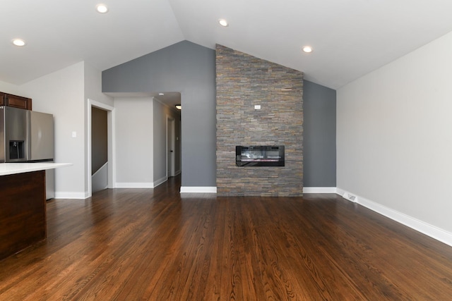 unfurnished living room with high vaulted ceiling, dark hardwood / wood-style flooring, and a fireplace