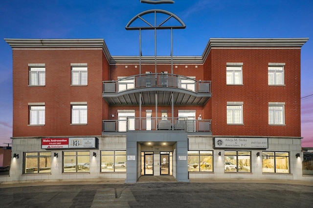 view of outdoor building at dusk