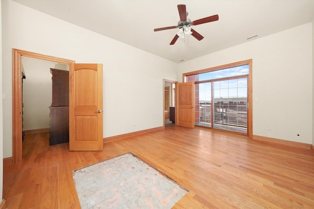 empty room featuring ceiling fan and wood-type flooring