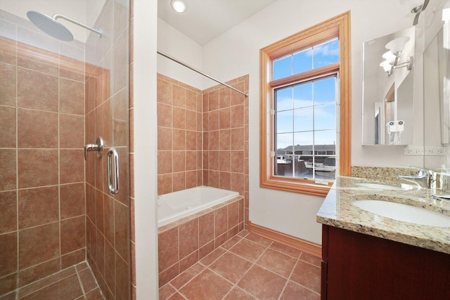 bathroom with vanity, tile patterned floors, and independent shower and bath