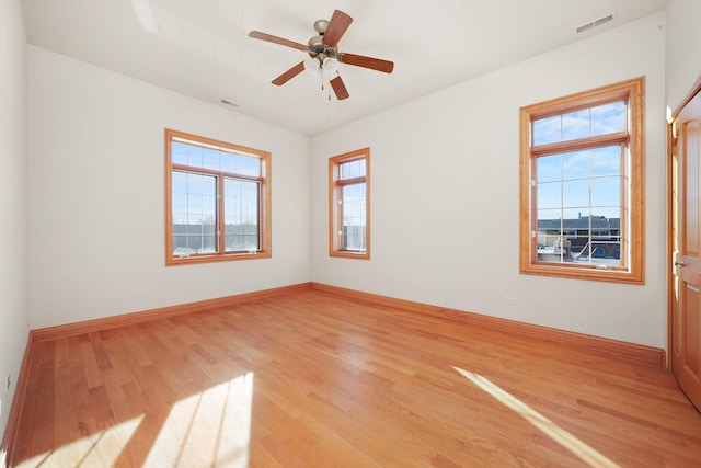 unfurnished room with ceiling fan and light hardwood / wood-style flooring