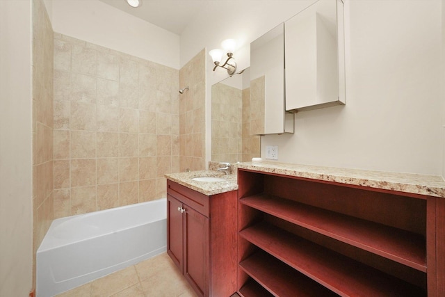 bathroom with tile patterned floors, tiled shower / bath combo, and vanity