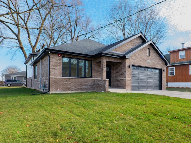 view of front of home with a garage and a front yard