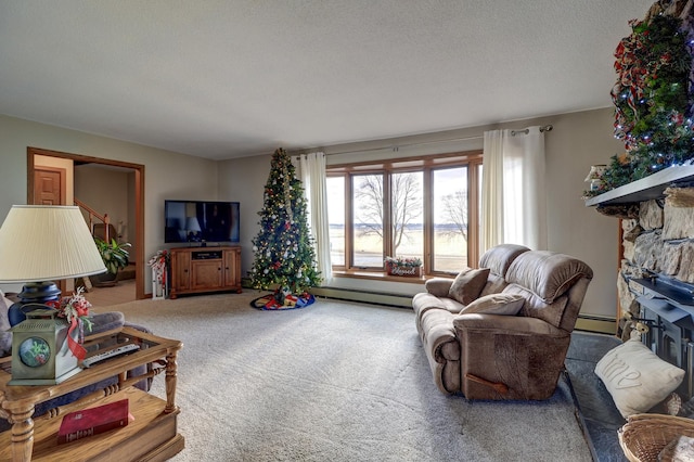 living room with a fireplace, carpet flooring, a textured ceiling, and a baseboard heating unit