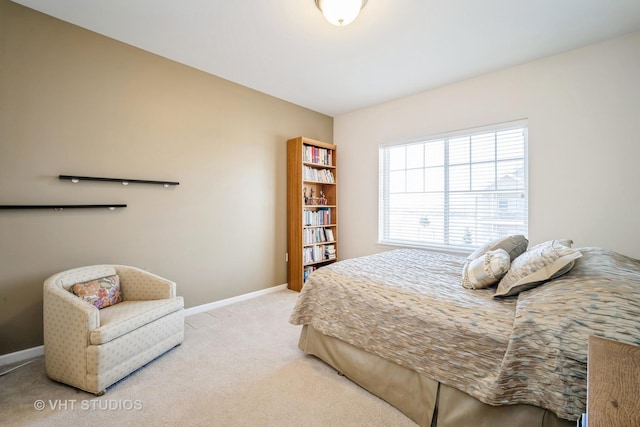 bedroom featuring light colored carpet