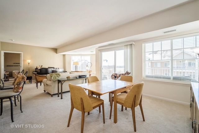 view of carpeted dining area