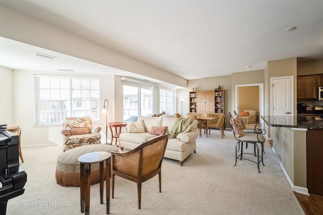 living room with light carpet