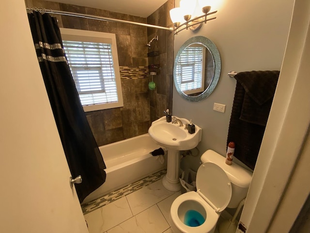 full bathroom featuring tile patterned floors, sink, toilet, a notable chandelier, and shower / tub combo with curtain