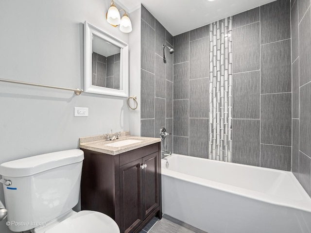 bathroom featuring tub / shower combination, toilet, and vanity