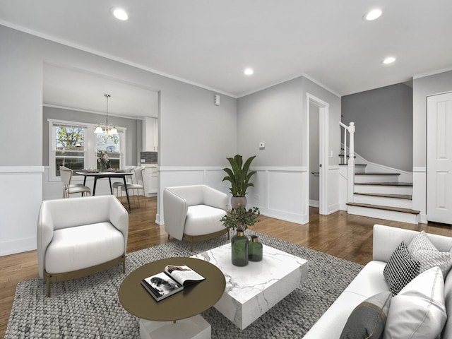 living room with a wainscoted wall, stairs, ornamental molding, recessed lighting, and wood finished floors