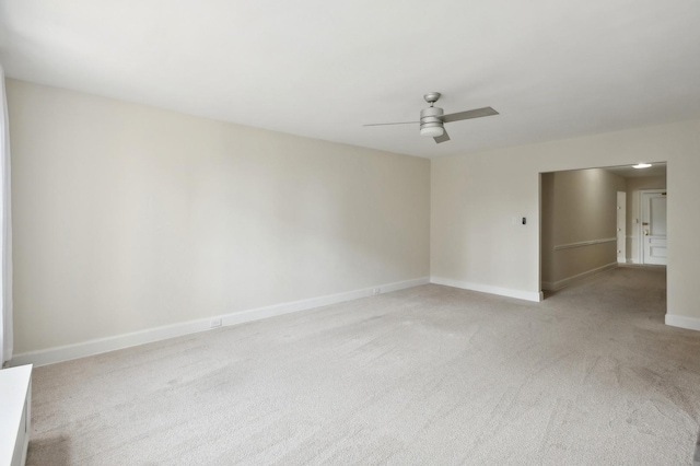 empty room featuring light carpet and ceiling fan