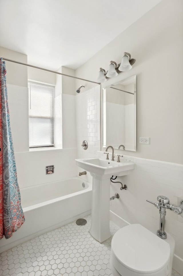 bathroom with toilet and shower / tub combo