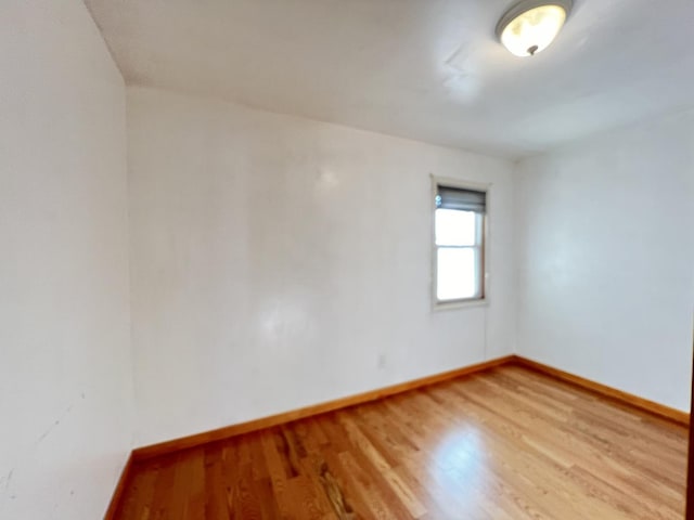 empty room featuring wood-type flooring