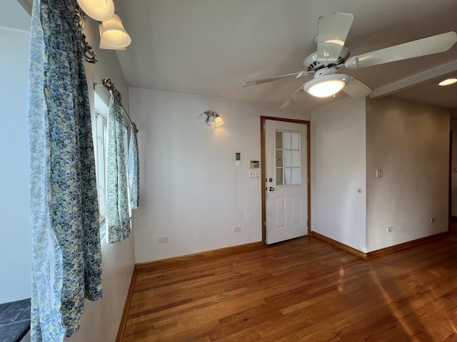 empty room featuring ceiling fan and wood-type flooring