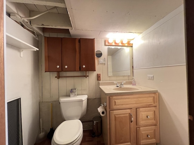 bathroom featuring toilet and vanity