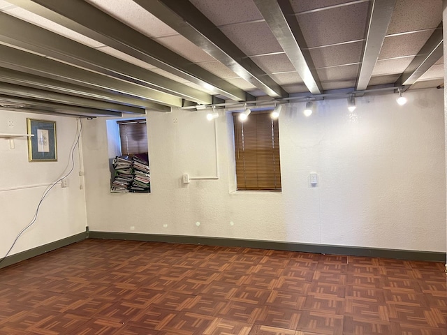 basement with dark parquet floors