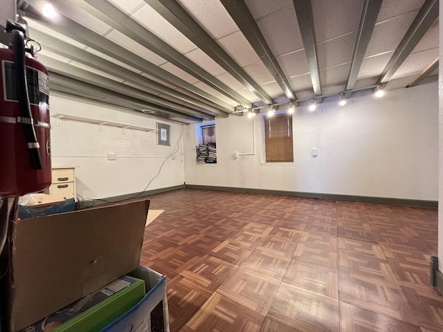 basement with dark parquet floors