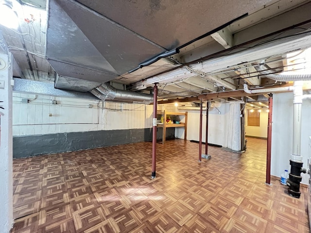 basement with parquet flooring