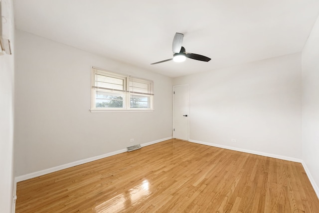 unfurnished room with ceiling fan and light hardwood / wood-style flooring