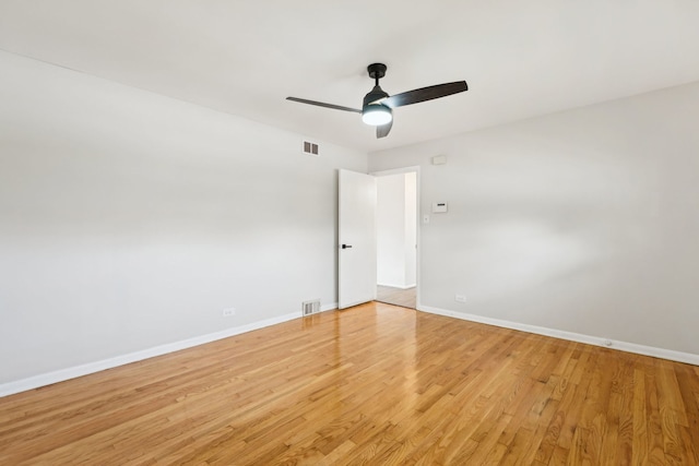 spare room featuring ceiling fan and light hardwood / wood-style floors