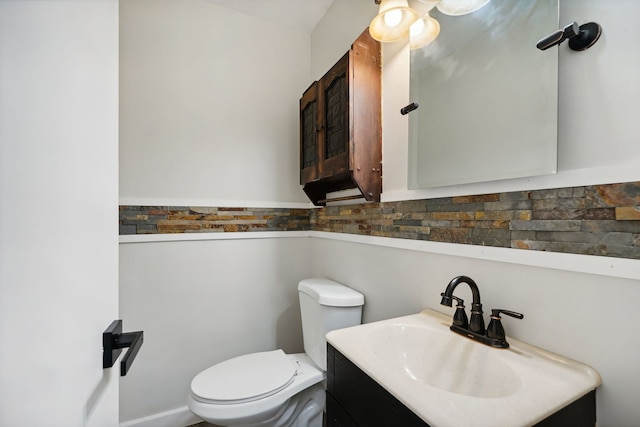 bathroom with toilet and vanity