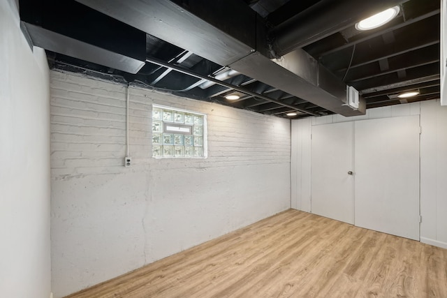 basement featuring light hardwood / wood-style floors