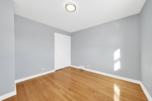 empty room featuring wood-type flooring