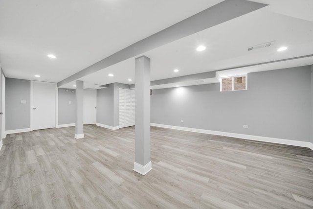 basement featuring light wood-type flooring