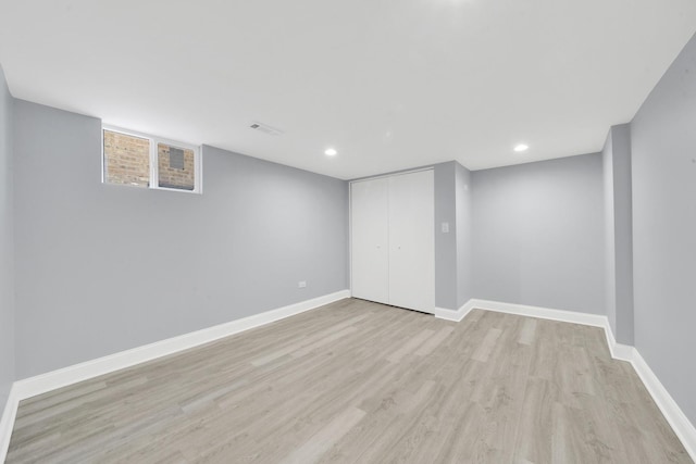 basement with light wood-type flooring