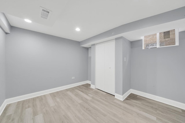 basement featuring light hardwood / wood-style floors