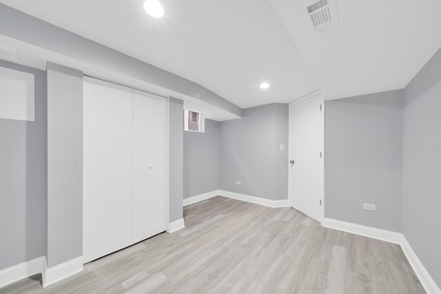 basement featuring light wood-type flooring