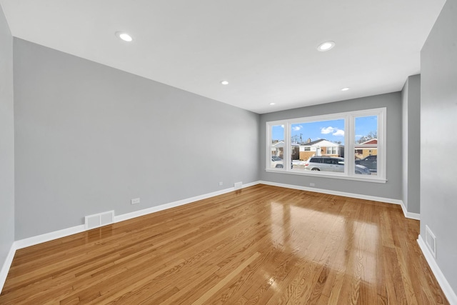 spare room featuring light wood-type flooring