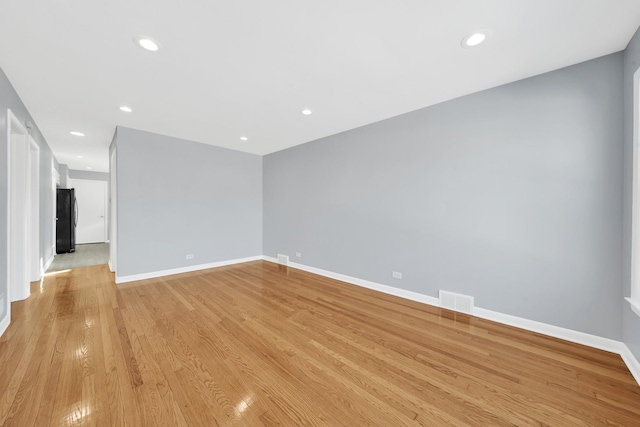 spare room featuring light hardwood / wood-style flooring