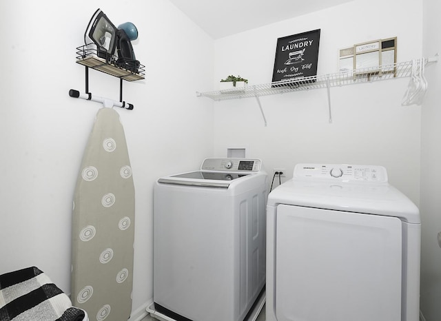 laundry room with washer and clothes dryer